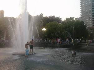 Kids cooling off at Washington Square Park in New York City