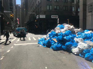 On Twitter, “Trash Heaps of FiDi” (@FiDiTrash) documents Downtown’s trash pile problem. Photo from Trash Heaps of FiDi