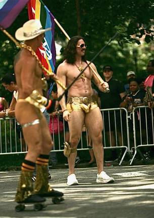 Shirtless muscle men at Heritage of Pride.