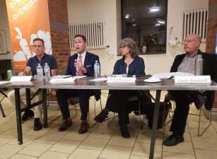 CB7 transportation committee chair Howard Yaruss (left), was joined at the forum by Ed Pincar, Rachel Weinberger and Charles Komanoff (l to r).