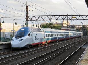 Passing through the Port Chester station on Metro-North’s tracks, Amtrak’s Boston-bound NextGen Acela train 2170 shows off its distinctive colors and brand-new equipment.
