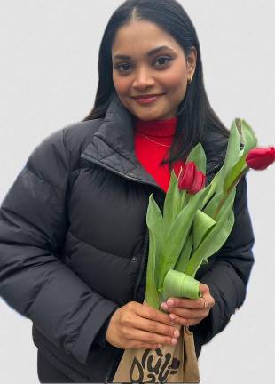 Sanyukta Garat with a small bouquet of tulips at Tulip Day in New York on March 30.
