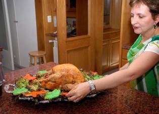 A Christmas table by Elaine Lloyd. Turkey is the most popular bird to adorn a Christmas feast in the US and Britain. But it is far from the old delight, the Christmas goose.