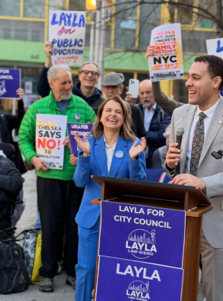 Law-Gisiko (center) held a celebratory rally with Council Member Christopher Marte (right) after surviving the challenge.