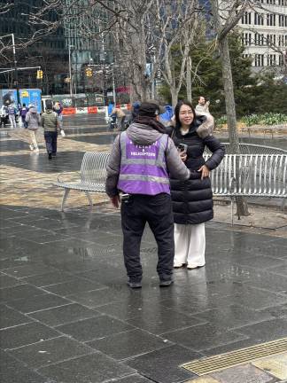 A ticket scammer approaches a tourist.