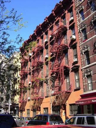 Neo-Grec Old Law tenements at 141-145 Sullivan Street, from 1875, now part of the Sullivan Street Historic District. Courtesy of the Greenwich Village Society for Historic Preservation