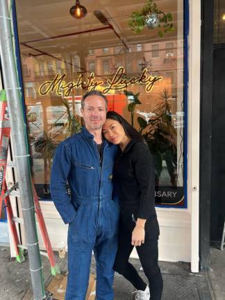 Beau Allulli and Doo Kim, the co-founders of the Mighty Lucky dispensary, posing in front of their legally-licensed store on the Bowery.