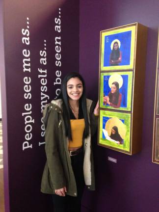 Maria Rodriguez, a 10th grader at Leadership and Public Service High School, next to a tryptich inspired by Pauli Murray, the civil and women’s rights activist whose life is the subject of an exhibit at St. Paul's Chapel. Photo: Clarrie Feinstein