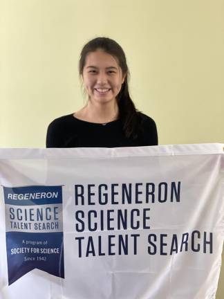 Victoria Li with the Regeneron banner. Photo courtesy of Victoria Li