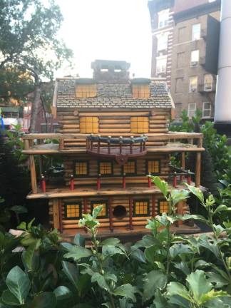 This log-cabin inspired birdhouse once started off as an old beer skid that Mele found behind a bar. Photo: Carson Kessler