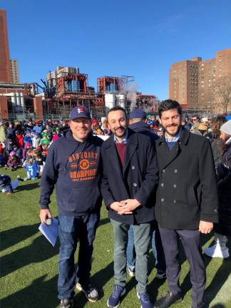 Keith Powers (center) at an opening day Little League ceremony in March 2023.
