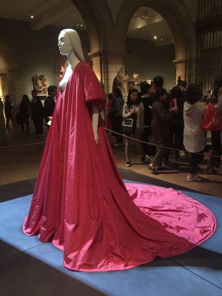 Crimson splendor in the Medieval Sculpture Hall: Pierpaolo Piccioli’s design for Valentino, "Evening Dress," autumn/winter 2017-18 haute couture. Red silk taffet. Valentino S.p.A. (Italian, founded 1959). Pierpaolo Piccioli (Italian, born 1967). Courtesy Valentino S.p.A. Hair by Shay Ashual. Photo: Val Castronovo