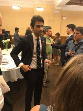 Suraj Patel, who is seeking to oust Congresswoman Carolyn Maloney in a Democratic primary challenge on the East Side, mingles with voters at a town hall last month in an East 88th Street church. Photo: Douglas Feiden