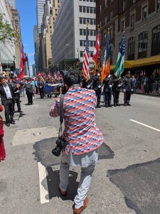 Photographing the photographers at Nepal Day parade, NYPD in the line of march.