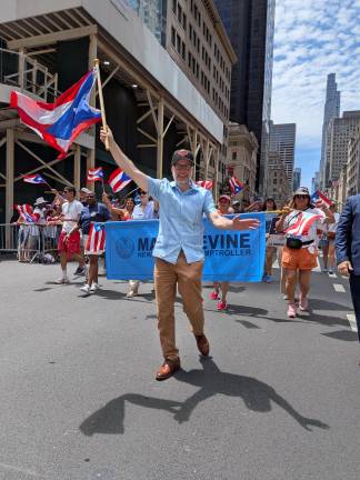 Puerto Rican Day Parade included Borough President Mark Levine in a Knicks hat.