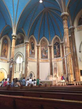 Holy Communion during the last Mass at St. Veronica's Church Sunday, June 25. Photo: Estelle Pyper