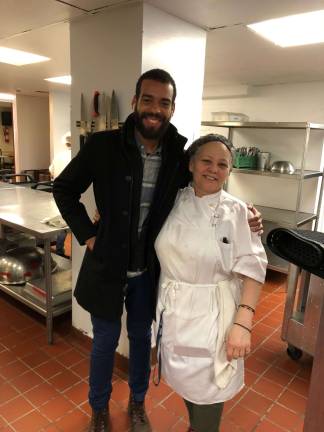 "It's a beautiful celebration," said food service manager Erick Splick (left), preparing for the holiday in the kitchen with cook Mayra Larancuent. Photo: Shoshy Ciment