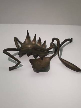 &#x201c;Woman with Her Throat Cut,&#x201d; 1932, an abstracted female figure splayed on the floor that looks more like a bug than a human. Photo: Val Castronovo
