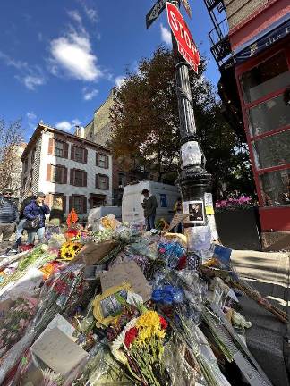 Flowers and notes that people have left in memory of Matthew Perry.