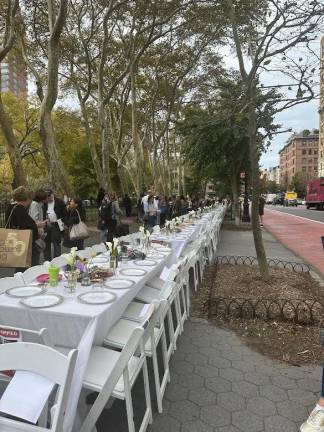 Empty Shabbat table installation outside of the American Museum of Natural History.