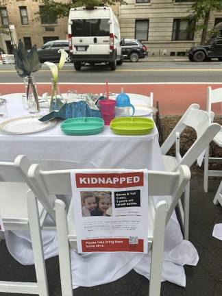 Empty chair for twin Israeli 3 year old girls.