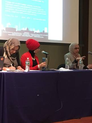Debbie Almontaser, board director of the Muslim Community Network, center, and Iram Ali, campaign director of MoveOn.org, right, participate in a panel discussion on Islamophobia moderated by New York University student Sana Mayat, left, Feb. 3. Photo: Claire Wang