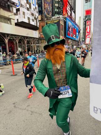 A bearded leprechaun runs up Seventh Avenue at NYC Half Marathon.