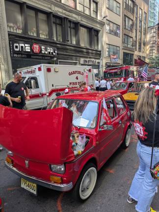 A bright Polish red Fiat ready to roll up Fifth Avenue.