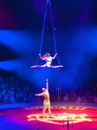<b>Trapeze artists Iryna Galenchyk &amp; Vladislav Drobinko say they have to have absolute trust in one another as they perform a high wire act in the Big Apple Circus. </b>Photo: Heather Stein &amp; Geoffrey Potter