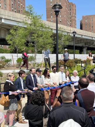 The ribbon cutting for Stuyvesant Cove Park. From left to right: Jane R. Crotty, Stephen Levin, Keith Powers, Thomas Foley, Carolina Rivera, Kyle Athayde, Andrew Kimball, Victoria Cerullo, and Janet Handa.