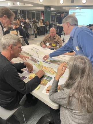Community members shared their input on a variety of possible designs for new flood-mitigating infrastructure, to be completed by 2026. Photo: Abigail Gruskin
