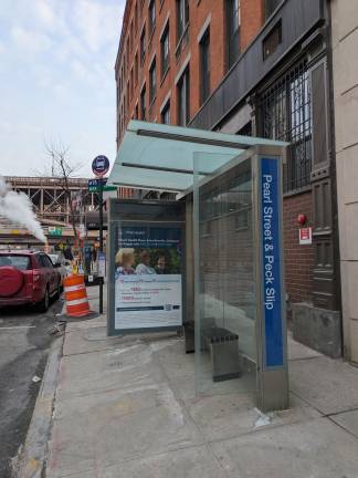 Bus stop at Pearl Street &amp; Peck Slip, homeless shelter &amp; elementary school.