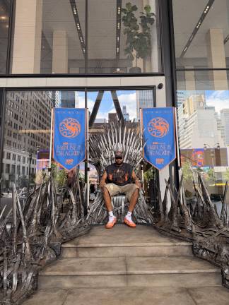 Karl-Anthony Towns, part of the NBA Championship-winning Knicks team, sat atop the Iron Throne prior the premiere House of the Dragon season 3 June 21.