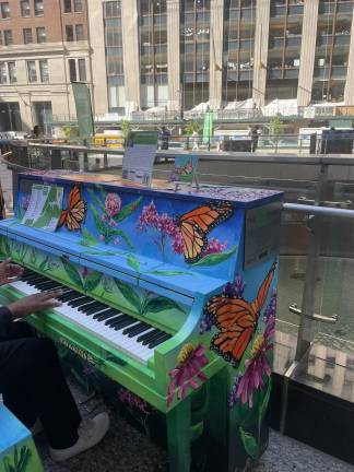 Christopher Spinelli’s ‘Monarchs and Milkweed’ piano was one of 25 pianos revealed during the launch event, inviting passersby and pianists to play over the course of the day. (Photo: Jacqueline Gordon)