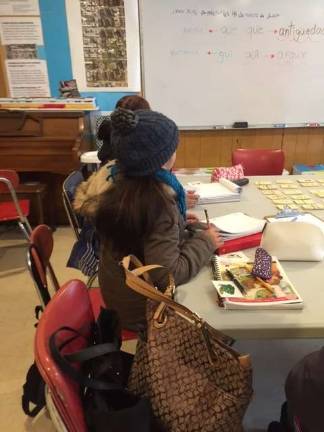 Students in class. Photo courtesy of CREA