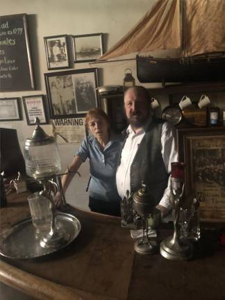 <b>Genie and Lorcan Otway behind the bar at their William Barnacle Tavern that adjoins Theatre 80 on St. Mark’s Place.</b> Photo: Keith J. Kelly