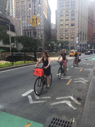Cyclists along Park Row, which is scheduled for bicycle and pedestrian safety improvements. Photo: Carson Kessler