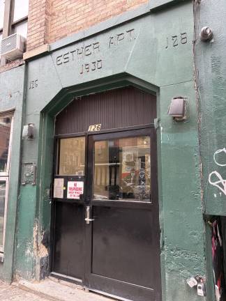 Front door of 126 Ludlow St., note Esther Apt. and 1930 in mock Hebrew-style script above the doorway.