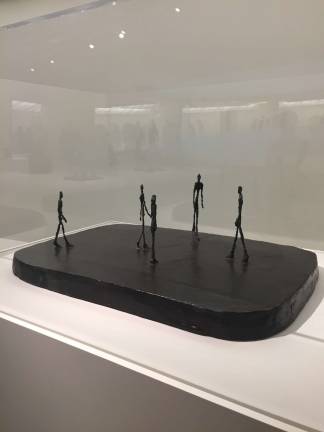 In &quot;City Square&quot; (1948), the figures are overwhelmed by a large base, perhaps signalling man's trifling place in the world. Photo: Val Castronovo