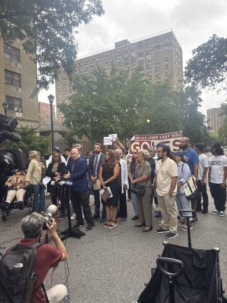 Council Member Harvey Epstein, Assemblymember Keith Powers behind him, speaks at Haven Plaza rally on July 30.