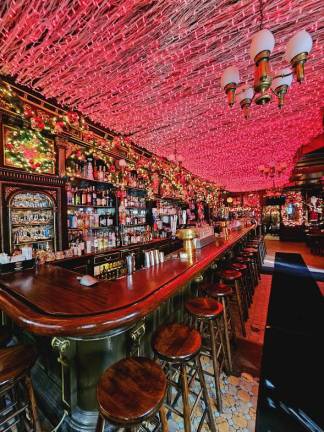 In side of Pete’s Tavern, showcasing the red strung lights encompassing the entire ceiling.