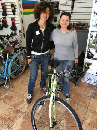 Angela Azzolino (left) with Gina, a GWC member, after a few test rides. Photo: GWC