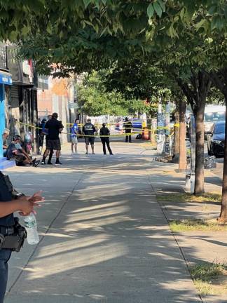 The scene of a double-shooting at Delancey St. and Eldridge St. on August 1. Two NYPD sergeants were struck by one bullet, and survived.