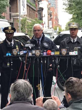 John Miller, the NYPD’s deputy commissioner of intelligence and counterterrorism, addressed reporters Friday morning on West 52nd Street after police disposed of an explosive device found at a USPS facility. Photo: NYPD