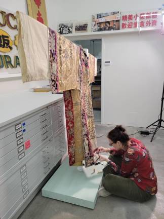 Garments were painstakingly restored at the Museum of the Chinese in America after a five alarm fire at its Mulberry St. quarters in Jan. 2020 nearly wiped it out. People across the country came to its aid and rallied to support it. Photo: Museum of the Chinese in America