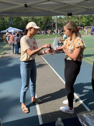 Receiving a hand stamp at the AAPI Care Fair. Photo courtesy of Michelle Tran, Soar Over Hate