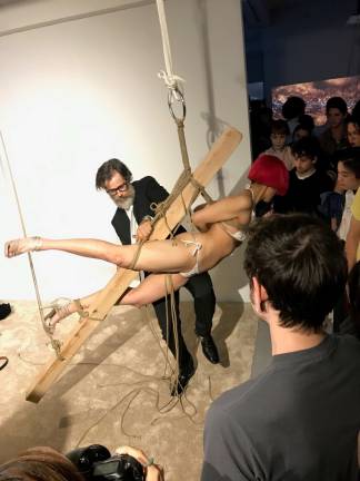 Emma Sulkowicz and “Mr. Whitney” in Sulkowicz’s performance, “The Ship is Sinking,” Saturday, May 20, at The Elizabeth Foundation for the Arts Project Space. The piece was part of the opening reception for the end-of-year exhibition of work by the Studio section students enrolled in The Whitney Museum of American Art’s Independent Study Program. Photo: Dante Pronio 