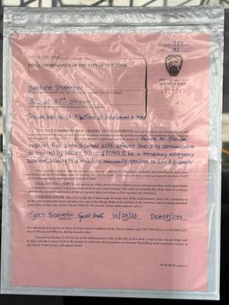 An FDNY vacate order at 320 W. 31st St., which was serving as a migrant shelter.