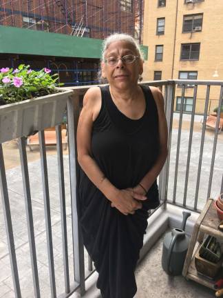Sharon Canns, pictured on her balcony last fall after she was charged for repairs she says were never finished. She and several other tenant advocates attribute many rent-stabilized housing issues to lack of oversight by the DHCR. Photo: Madeleine Thompson