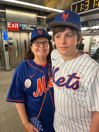 At the departure point at the Hudson Yards Station, a grandmother named Patrice and her grandson Mason were decked out in Mets gear ready to board the NYC Transit Museum’s first-ever nostalgia train to Citi Field on Opening Day.